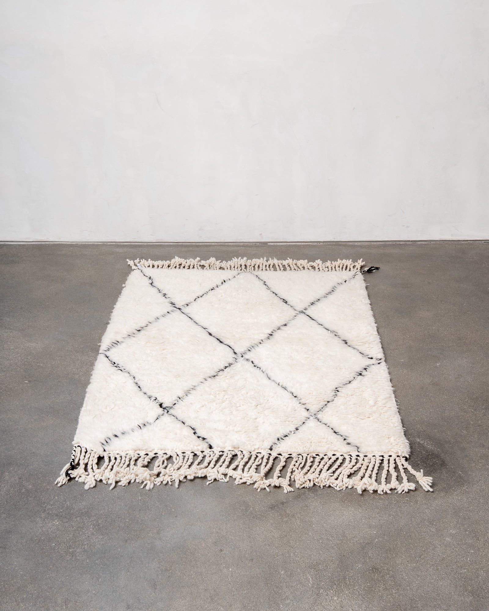 Modern, designer, handcrafted Berber rug from Morocco. Beniourain carpet with minimalist design, natural wool pile and a fluffy texture.
